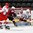GRAND FORKS, NORTH DAKOTA - APRIL 24: Denmark's Kasper Krog #1 makes a save while Latvia's Valters Apfelbaums #7, Denmark's Nikolaj Krag #11 and Oliver Gatz #6 look on during relegation round action at the 2016 IIHF Ice Hockey U18 World Championship. (Photo by Matt Zambonin/HHOF-IIHF Images)

